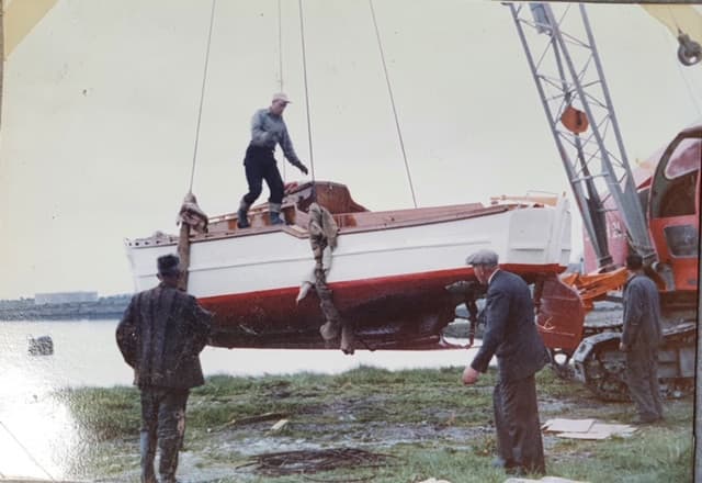 A boat being craned into the water at Foynes